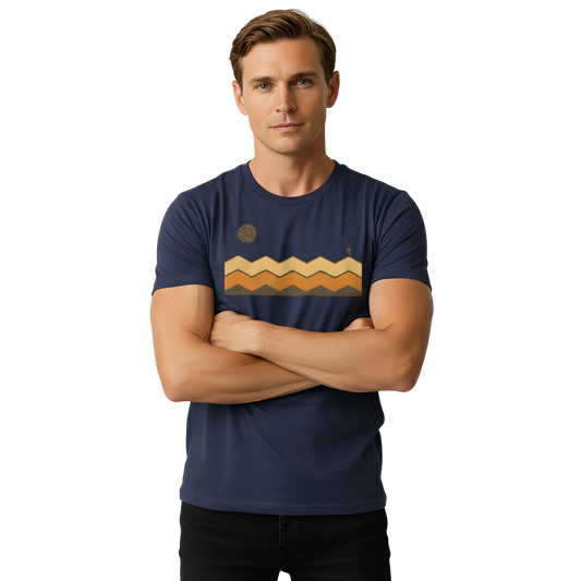 Man wearing a navy blue t-shirt with a graphic design on a plain background