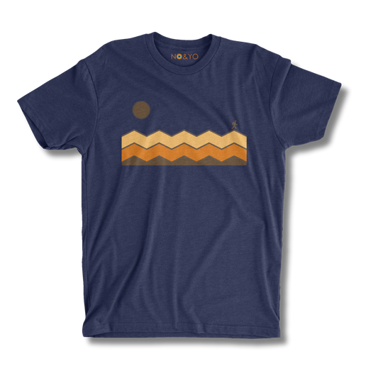 Front view of NO&YO blue Solo Traveler tee with sun and mountain trail design.