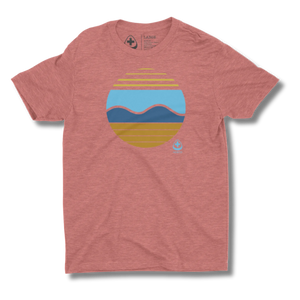 Red t-shirt with a colorful sun and waves graphic design on a red background