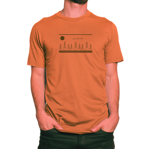Model wearing orange NO&YO wilderness graphic tee with tree and sun illustration