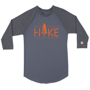 Hit the trails in style with the NO&YO HIKE Adventure Raglan Tee. Featuring a bold distressed “HIKE” graphic with a tree design, this 3/4 sleeve baseball-style shirt is perfect for outdoor lovers who want both comfort and edge. Made with soft, breathable cotton blend fabric, it’s designed for durability whether you’re on a weekend hike, camping, or relaxing fireside. The contrasting charcoal sleeves and heather grey body give it a modern outdoor look, while the curved hem adds extra comfort and mobility.