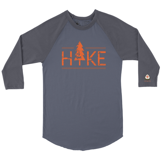 Hit the trails in style with the NO&YO HIKE Adventure Raglan Tee. Featuring a bold distressed “HIKE” graphic with a tree design, this 3/4 sleeve baseball-style shirt is perfect for outdoor lovers who want both comfort and edge. Made with soft, breathable cotton blend fabric, it’s designed for durability whether you’re on a weekend hike, camping, or relaxing fireside. The contrasting charcoal sleeves and heather grey body give it a modern outdoor look, while the curved hem adds extra comfort and mobility.