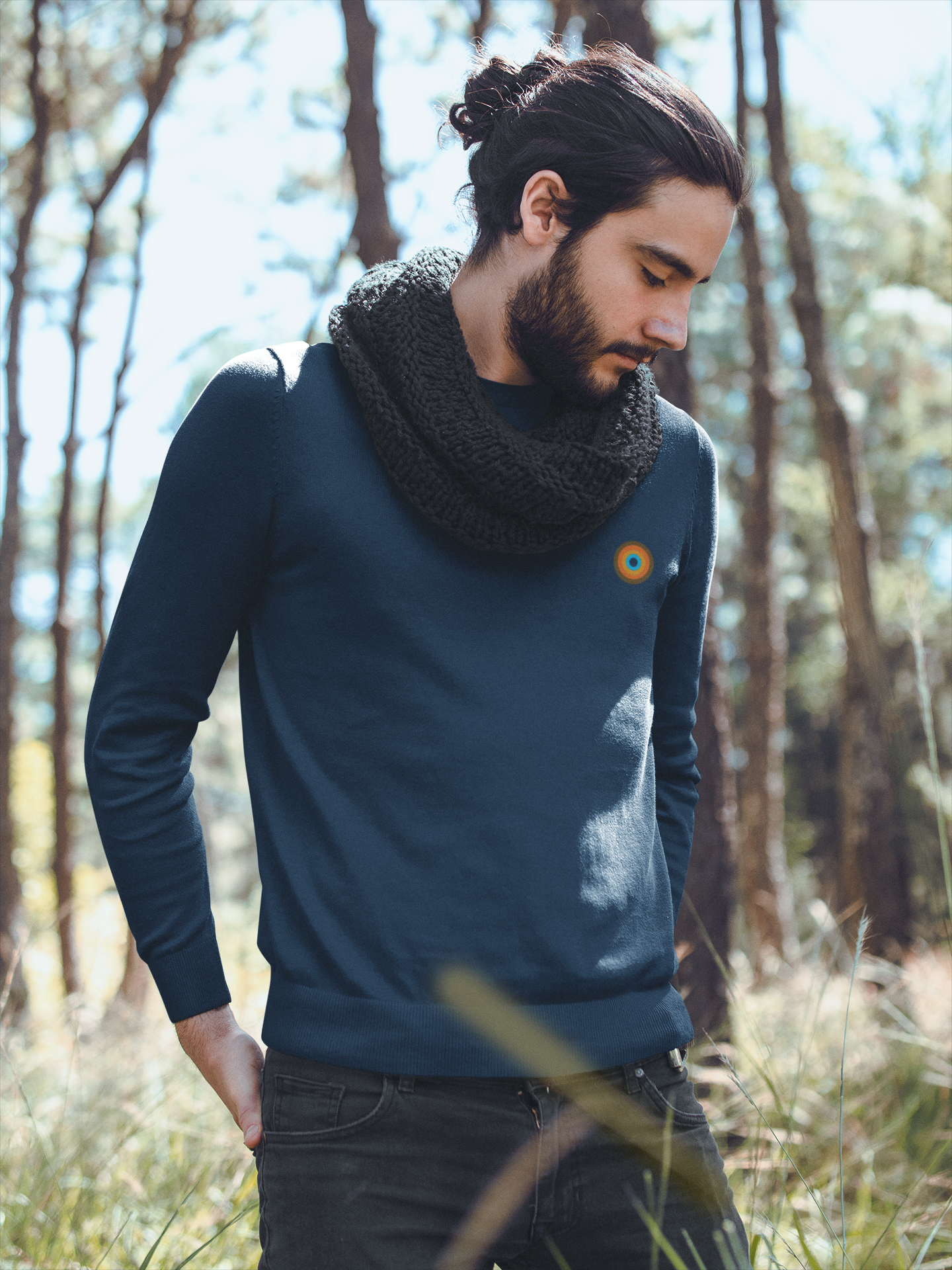 Model wearing NO&YO Heather Midnight Navy crewneck sweatshirt in outdoor forest setting, styled with scarf.