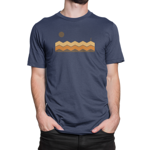 Front view of NO&YO blue Solo Traveler tee with sun and mountain trail design.