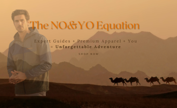 NO&YO luxury adventure apparel featured on a model in a desert exploration setting, designed for modern travelers and outdoor explorers.