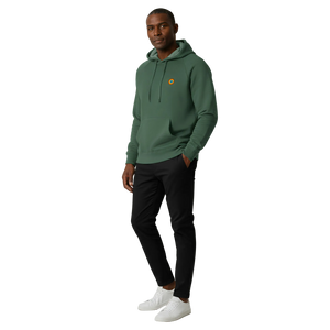 Man wearing a green hoodie with a logo on a white background