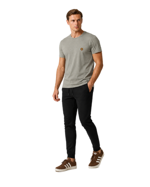 NO&YO men’s Heather Stone embroidered badge t-shirt, angled studio lifestyle model showcasing premium minimalist design.
